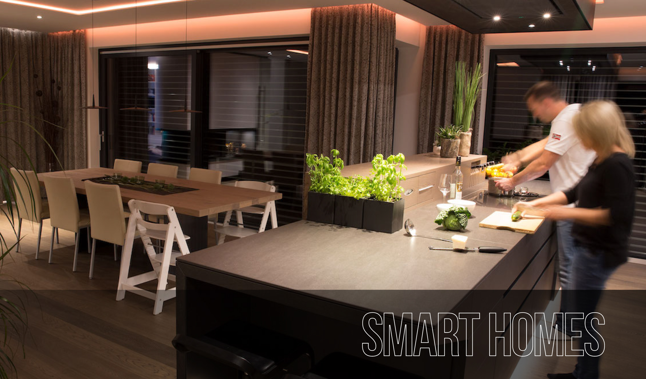 A couple preparing a meal in a stylish Smart Home kitchen diner