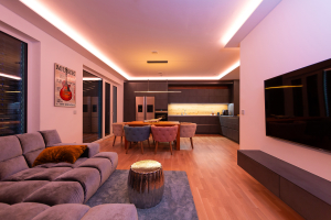 Modern open plan living room & kitchen diner showing smart lighting